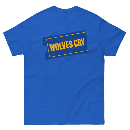 A royal Blockbuster movies tee shirt, 90s style, blue short-sleeve t-shirt shown from the back, featuring a graphic print of the word 'WOLVES CRY' in yellow text inside a dark blue and yellow outlined badge.