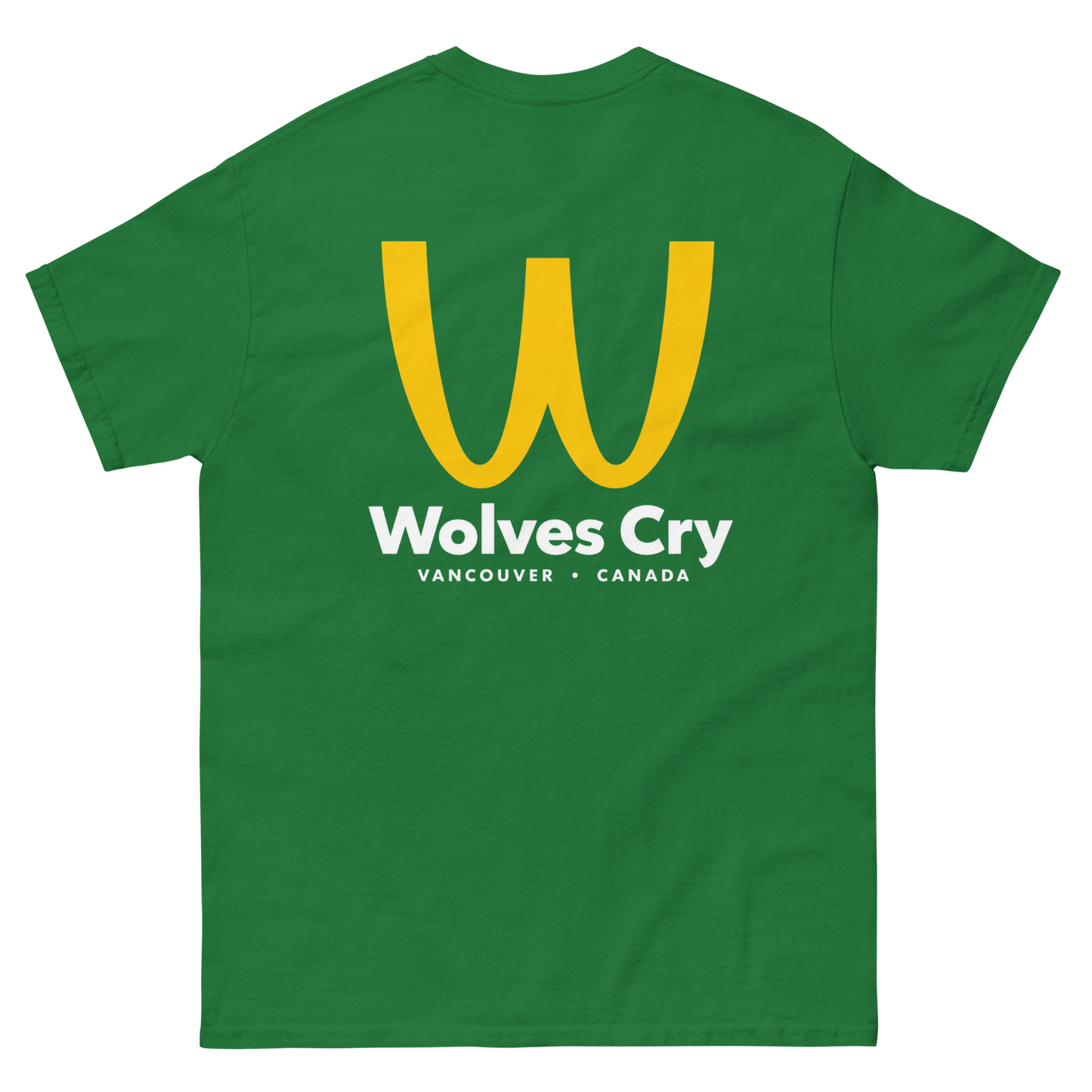 A green short-sleeve t-shirt with a large yellow 'W' logo and white text reading 'Wolves Cry' and 'VANCOUVER • CANADA' on the front, shown against a plain white background. McDowells restaurant tee shirt, coming to America parody bootleg