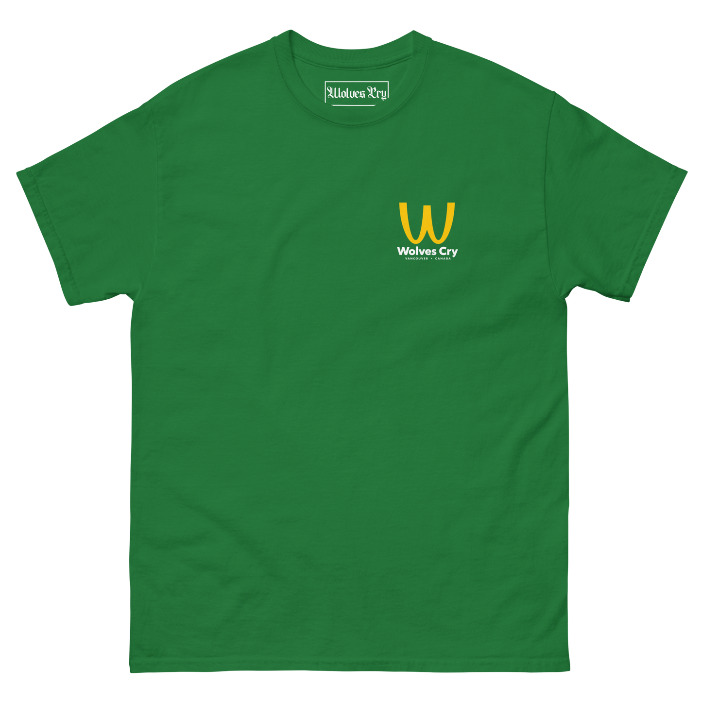 A green short-sleeve crewneck t-shirt with a small yellow and white 'Wolves Cry' logo printed on the left chest, displayed on a clean white background. McDowells restaurant tee shirt, coming to America.