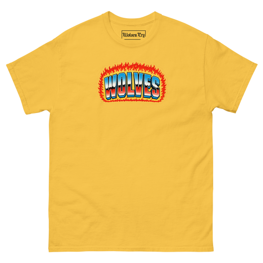 A yellow short-sleeve crewneck t-shirt featuring a retro-style graphic on the chest with the word 'WOLVES' in blue and white 3D letters outlined in red, set against a background of orange and red flames. The inner collar label shows the brand 'Midlace Rug'.