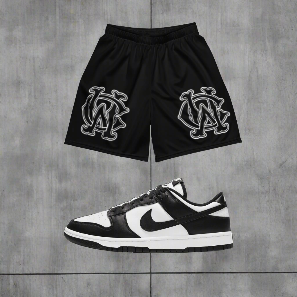 Model wearing Wolves Cry Originals OG Mesh Shorts Black & White Classic Edition, styled for a bold streetwear look with versatile and sustainable performance.