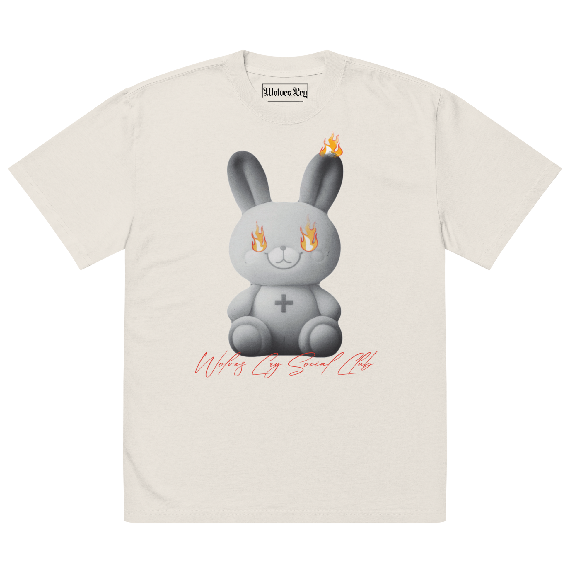 Front view of Wolves Cry Originals Oversized Teddy Tee in bone off-white, featuring a bold graphic of a teddy bear engulfed in flames, symbolizing resilience and nostalgia.