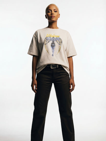 Full body view of model wearing Wolves Cry Originals Angels oversized tee in bone showcasing the oversized drape and modern streetwear silhouette.