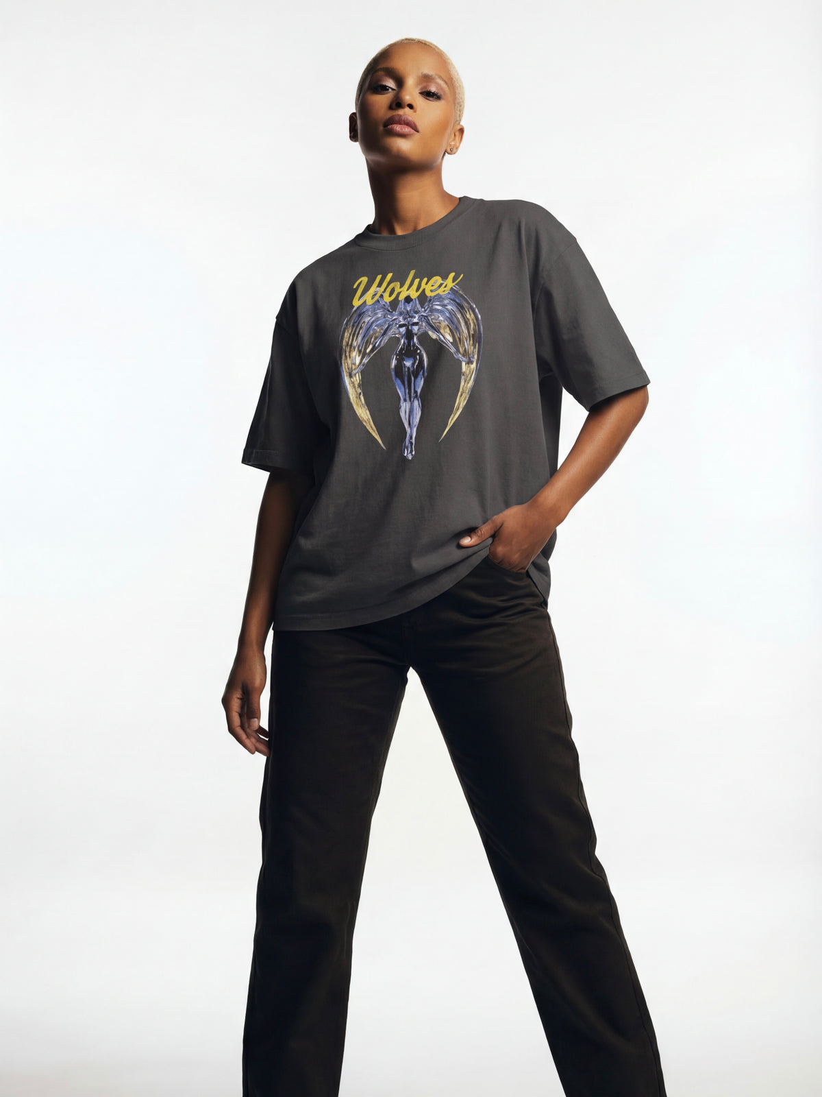 Full body view of model wearing Wolves Cry Originals Angels oversized tee in vintage black showcasing the oversized drape and modern streetwear silhouette.