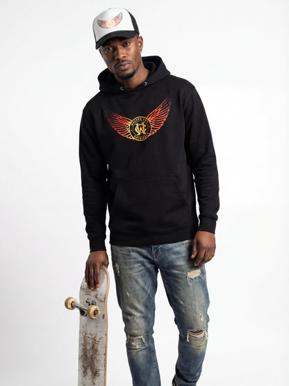 Man wearing a black hoodie with a logo, holding a skateboard on a white background