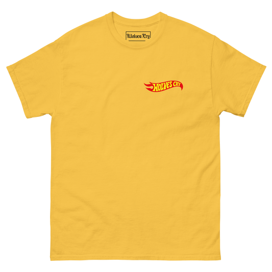 A yellow short-sleeve crewneck t-shirt featuring a small red and yellow 'wolvea cry hot wheels tee shirt.' logo on the left chest, displayed on a clean white background. 90s style nostalgia tee