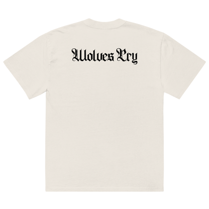 An off-white short-sleeve t-shirt shown from the back, featuring the text 'Wolves Cry' printed in a black Gothic font across the upper back.