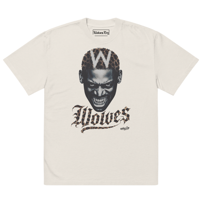 An off-white short-sleeve t-shirt featuring a graphic print of a snarling Dennis Rodman face with a leopard-print 'W' on his head and the word 'Wolves' in a gothic font below.