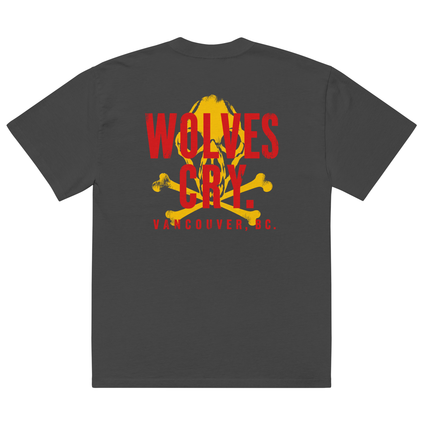 A dark gray crewneck t-shirt shown from the back, featuring a large graphic print with a yellow skull and crossbones behind red text that reads 'WOLVES CRY' and 'VANCOUVER, BC.' below it.